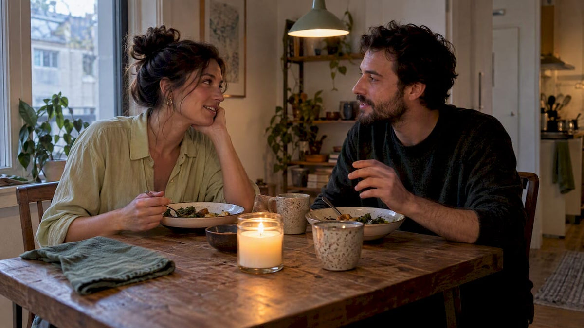 Couple sharing dinner by a lit candle