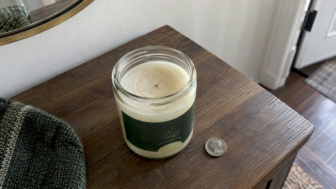 Cooled coin candle beside its silver coin